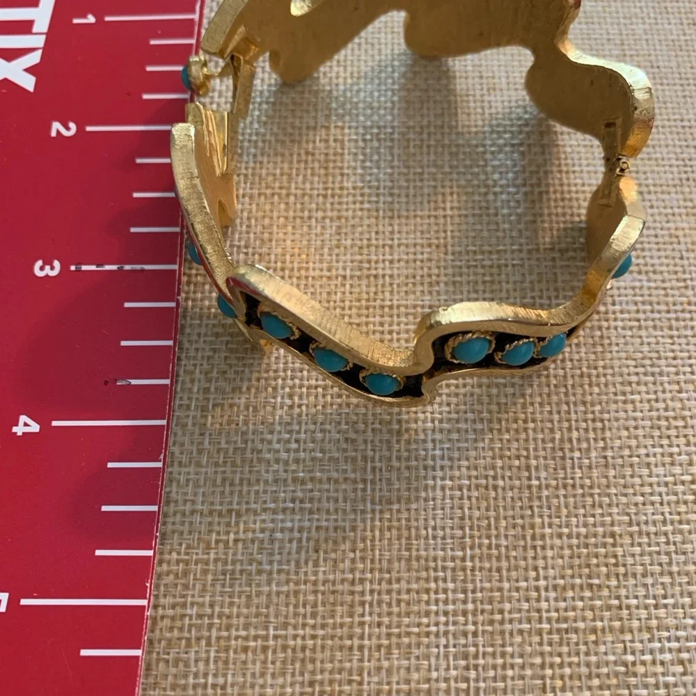 Striking vintage turquoise color black and gold cuff bracelet